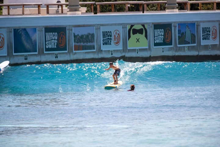 image of a teenager in a beginner surf sessions at waco surf a texas water park