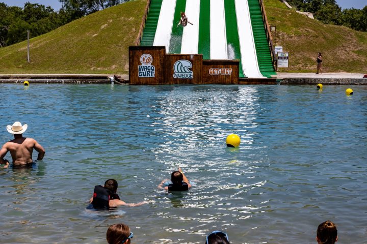 a group of people swimming in a body of water